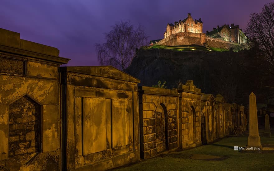 View of Edinburgh Castle from a churchyard in Scotland