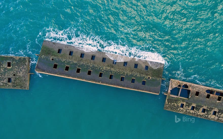 Remains of the Mulberry harbour from the D-Day invasion at Arromanches, Normandy, France